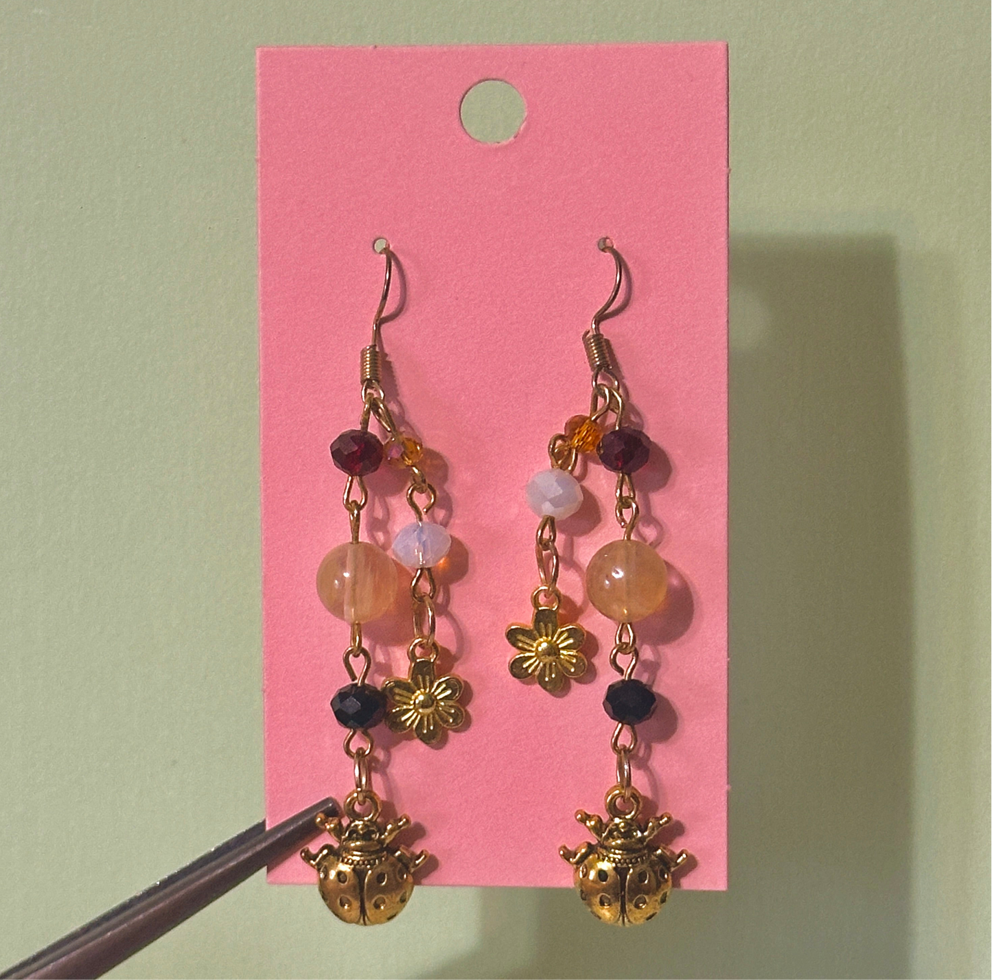 The golden ladybug earrings