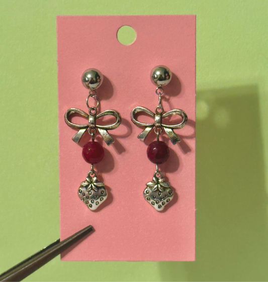 The coquette strawberry earrings